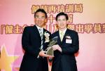 Mr. Alkin Kwong (right), Vice Chairman & Chief Executive of Hong Yip, receiving the 11th "Employers' Gold Star Award - Platinum Award" from Mr. Michael Tien , Chairman of Employee Retraining Board 