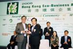 Mr. Edmund Kwok (right), Executive Director of Hong Yip Service Co. Ltd., receiving the Gold Award from Mr. Joseph Lee, JP, Chairman of Environmental Campaign Committee